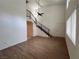 Bright living room boasts hardwood floors, high ceilings, and a staircase at 5253 Westwind Rd, Las Vegas, NV 89118