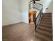 Bright living room showcasing high ceilings, wood floors, and access to the kitchen at 5253 Westwind Rd, Las Vegas, NV 89118