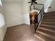 Open-concept living room features wood-style floors, high ceilings and staircase at 5253 Westwind Rd, Las Vegas, NV 89118