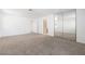 Spacious main bedroom features carpet flooring, mirrored closet doors and ample natural light at 5253 Westwind Rd, Las Vegas, NV 89118