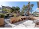 Private patio with a seating area and a decorative fence, creating a cozy outdoor space for relaxation at 5253 Westwind Rd, Las Vegas, NV 89118