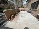 Private patio featuring concrete flooring, garden wall, mature trees and outdoor seating at 5253 Westwind Rd, Las Vegas, NV 89118