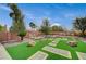 Expansive backyard with manicured landscaping and artificial turf; ideal for outdoor enjoyment at 549 Via Balizan Ave, Las Vegas, NV 89123