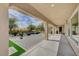 Large, covered patio leads to backyard oasis with stone pavers and outdoor seating at 549 Via Balizan Ave, Las Vegas, NV 89123