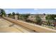 Balcony featuring a wrought iron railing and view of the desert landscape at 549 Via Balizan Ave, Las Vegas, NV 89123