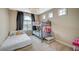 Bedroom features a bunk bed, an additional twin bed, chandelier, and natural light at 549 Via Balizan Ave, Las Vegas, NV 89123