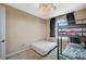 Charming bedroom features a twin bed, bunk bed, and arched window for a cozy and functional space at 549 Via Balizan Ave, Las Vegas, NV 89123