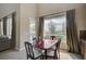 The spacious dining area offers bright natural light, tile flooring, and views of the property at 549 Via Balizan Ave, Las Vegas, NV 89123