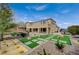 Expansive home featuring a balcony, covered patio, lush landscaping, and boat parking at 549 Via Balizan Ave, Las Vegas, NV 89123