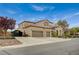 Beautiful two-story home with a three-car garage, gated driveway and meticulous front yard landscaping at 549 Via Balizan Ave, Las Vegas, NV 89123