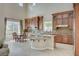 Gourmet kitchen with custom cabinets, granite countertops, and modern stainless steel appliances at 549 Via Balizan Ave, Las Vegas, NV 89123