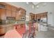Spacious kitchen featuring stainless steel appliances, granite countertops, and custom wood cabinetry at 549 Via Balizan Ave, Las Vegas, NV 89123