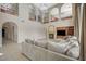 The spacious living room features a fireplace, high ceilings, and elegant arched openings at 549 Via Balizan Ave, Las Vegas, NV 89123