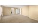 Expansive carpeted bedroom with dual closets, archway, and neutral tones at 5518 Ovando Way, Las Vegas, NV 89122