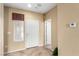 Welcoming entryway featuring a white door, neutral walls, and tiled floors at 5518 Ovando Way, Las Vegas, NV 89122