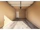 Spacious garage with concrete flooring and ample space for parking and storage at 5518 Ovando Way, Las Vegas, NV 89122