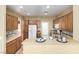 Charming kitchen with wooden cabinets, spacious counters, and white appliances at 5518 Ovando Way, Las Vegas, NV 89122
