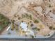 Expansive aerial view of desert property with a charming single-Gathering home, RV parking, and generous landscaping at 5570 N Nopah Vista Ave, Pahrump, NV 89060
