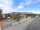 An aerial view of the property highlighting perimeter fencing and mountain views at 5570 N Nopah Vista Ave, Pahrump, NV 89060