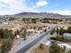 Expansive aerial view of a home, set amidst the serene landscape with mountain backdrop at 5570 N Nopah Vista Ave, Pahrump, NV 89060