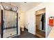 Bright bathroom features a tiled walk-in shower, closet, and neutral fixtures and finishes at 5570 N Nopah Vista Ave, Pahrump, NV 89060