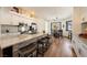 Elegant kitchen with a breakfast bar, connecting to a dining area with views to the outdoors at 5570 N Nopah Vista Ave, Pahrump, NV 89060