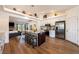 Modern kitchen featuring a large island with seating, stainless steel appliances, and open layout to living area at 5570 N Nopah Vista Ave, Pahrump, NV 89060