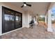 Relaxing covered patio with outdoor seating and grill, ideal for entertaining guests at 5570 N Nopah Vista Ave, Pahrump, NV 89060
