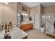 Bright bathroom features double vanity, framed mirrors, and glass enclosed shower, providing a modern and functional space at 5578 River Highlands Pl, Las Vegas, NV 89122