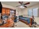 Bedroom featuring a desk with built-in shelves, a ceiling fan, and natural light at 5578 River Highlands Pl, Las Vegas, NV 89122