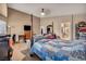 Bedroom showcasing a four poster bed, sitting area and ensuite bathroom at 5578 River Highlands Pl, Las Vegas, NV 89122