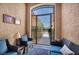 Cozy courtyard with comfortable seating, a decorative gate, and a welcoming ambiance for relaxing or greeting guests at 5578 River Highlands Pl, Las Vegas, NV 89122