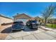 Inviting single Gathering home featuring a two-car garage and a driveway with ample parking for residents and guests at 5578 River Highlands Pl, Las Vegas, NV 89122