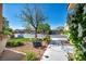 Inviting front porch with an attractive walkway and lush landscape offers a warm welcome to this charming home at 5578 River Highlands Pl, Las Vegas, NV 89122