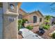 Attractive home featuring beautiful desert landscaping, including stone and lush plantings, adding to its curb appeal at 5578 River Highlands Pl, Las Vegas, NV 89122