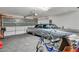 Spacious garage with ample storage and a vintage car at 5578 River Highlands Pl, Las Vegas, NV 89122