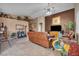 Comfortable living room featuring neutral tones, tile flooring and plenty of seating at 5578 River Highlands Pl, Las Vegas, NV 89122