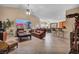 Open-concept living room featuring tile flooring, vaulted ceiling, and backyard views at 5578 River Highlands Pl, Las Vegas, NV 89122