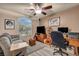 Living Room area featuring a sitting area, a desk and a large window with view of the outdoors at 5578 River Highlands Pl, Las Vegas, NV 89122