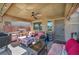 Relaxing outdoor patio area with ceiling fan, perfect for enjoying warm weather and outdoor meals at 5578 River Highlands Pl, Las Vegas, NV 89122