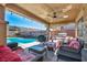 Spacious covered patio with comfortable seating, perfect for outdoor dining and lounging by the pool at 5578 River Highlands Pl, Las Vegas, NV 89122
