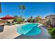 Inviting backyard pool with clear blue water, lounge chairs, and palm trees under a clear blue sky at 5578 River Highlands Pl, Las Vegas, NV 89122