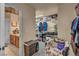 Spacious walk-in closet offering ample storage with shelves, hanging racks, and convenient access to an adjacent room at 5578 River Highlands Pl, Las Vegas, NV 89122