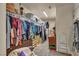 Well-organized walk-in closet with extensive shelving, hanging space, and efficient storage solutions for wardrobe management at 5578 River Highlands Pl, Las Vegas, NV 89122