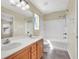 Bathroom with a double sink vanity, framed mirrors, and bathtub/shower combination at 5783 Sol Vista Ave, Las Vegas, NV 89122