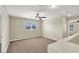 Neutral bedroom features a ceiling fan and a view to the outside at 5783 Sol Vista Ave, Las Vegas, NV 89122