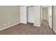 Bedroom featuring neutral walls, carpet, and a closet with sliding doors at 5783 Sol Vista Ave, Las Vegas, NV 89122