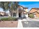 Charming two-story home with tile roof, desert landscaping, and an attached two-car garage at 5783 Sol Vista Ave, Las Vegas, NV 89122