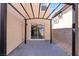 Covered patio with concrete floor, view of the backyard and sliding glass door at 5783 Sol Vista Ave, Las Vegas, NV 89122
