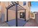 Covered patio with concrete floor, view of the backyard and sliding glass door at 5783 Sol Vista Ave, Las Vegas, NV 89122